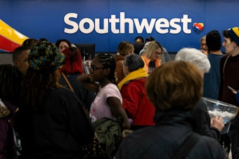 caption: Travelers wait in line at the Southwest Airlines ticketing counter at Nashville International Airport after the airline canceled thousands of flights in Nashville, Tenn., on Dec. 27, 2022. The Department of Transportation is investigating the disaster, which led to $220 million in losses for Southwest
