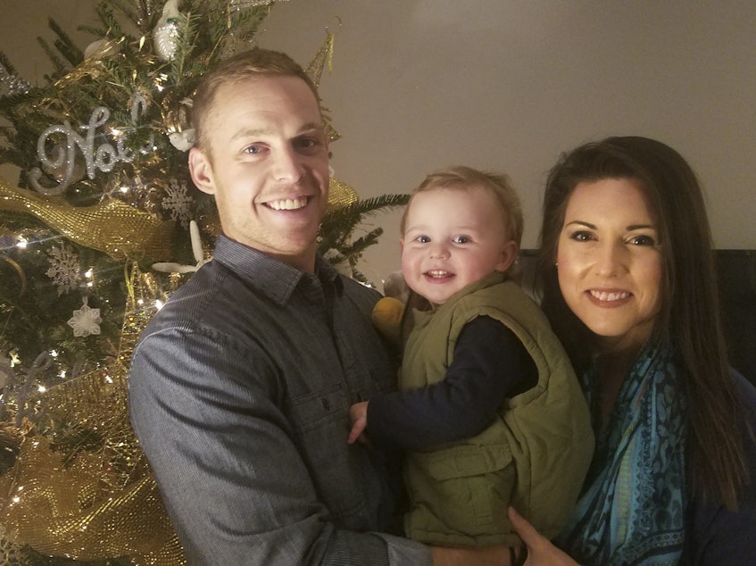 caption: Kaitlyn McCollum with her husband, A.J., and son, Louther, after learning of the Department of Education's decision to help teachers who had lost their TEACH grants because of paperwork problems.