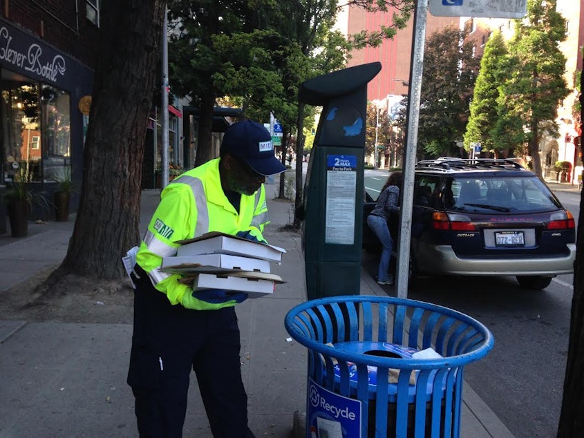 caption: Lee Townsend with the Metroplitan Improvement District checks his "hotspots" in Belltown for litter...and worse.