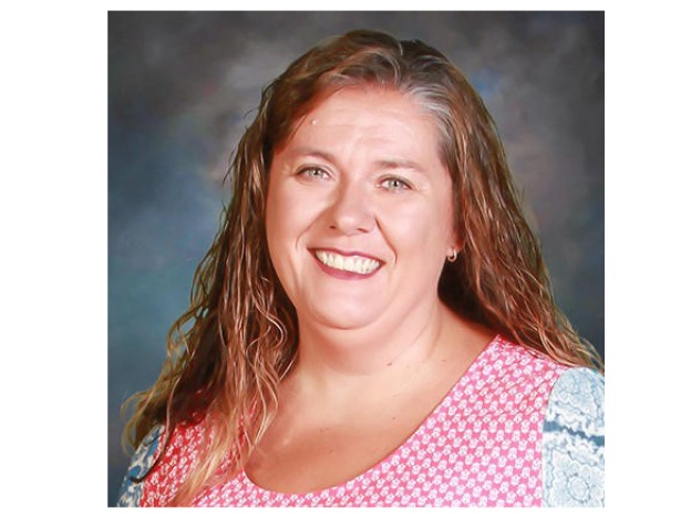 caption: Jennifer Carter, a teacher at Apalachee High School, said she "felt helpless" when she tried to protect her students during a shooting at the school this week.