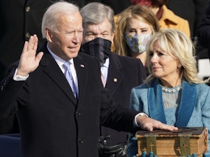 caption: Joe Biden is sworn in as the 46th president of the United States by Chief Justice John Roberts as Jill Biden holds the Bible during the 59th Presidential Inauguration at the U.S. Capitol in Washington, Jan. 20, 2021.