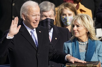caption: Joe Biden is sworn in as the 46th president of the United States by Chief Justice John Roberts as Jill Biden holds the Bible during the 59th Presidential Inauguration at the U.S. Capitol in Washington, Jan. 20, 2021.