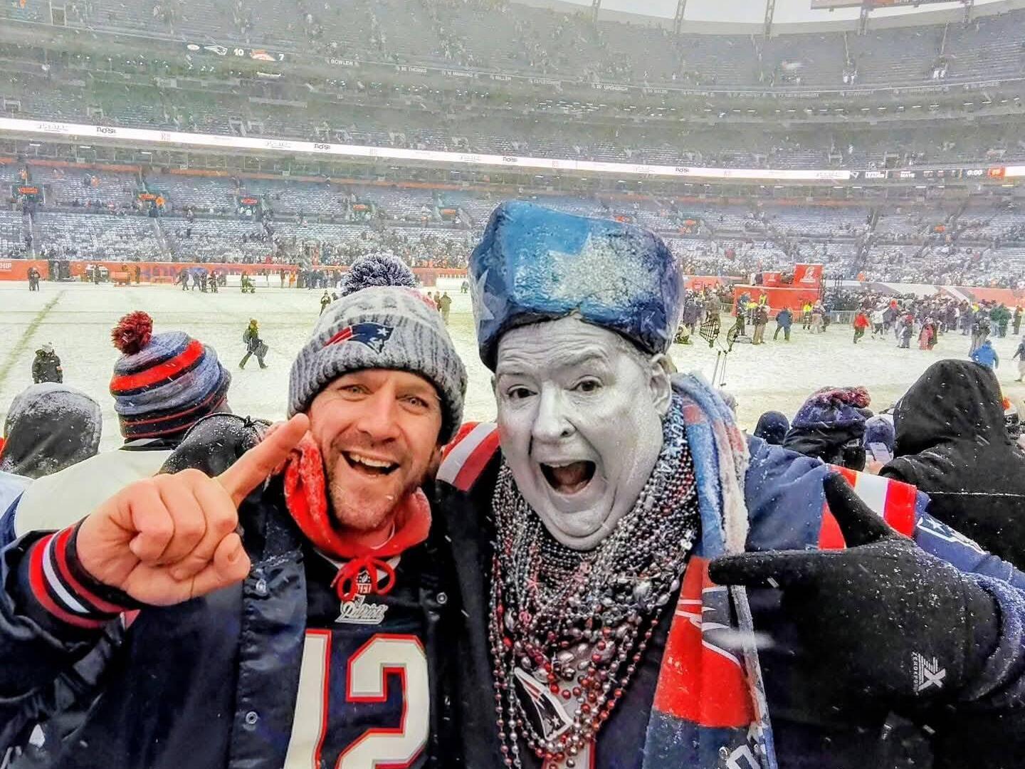 caption: Patriots superfan Keith Birchall (right) celebrated with a friend in Denver for the AFC Championship game and was thrilled to see the Pats punch their ticket to this year's Super Bowl. He's old enough to remember the Pats' losing years, and is appalled by the "cockiness and entitlement" in many spoiled young Pats fans today.