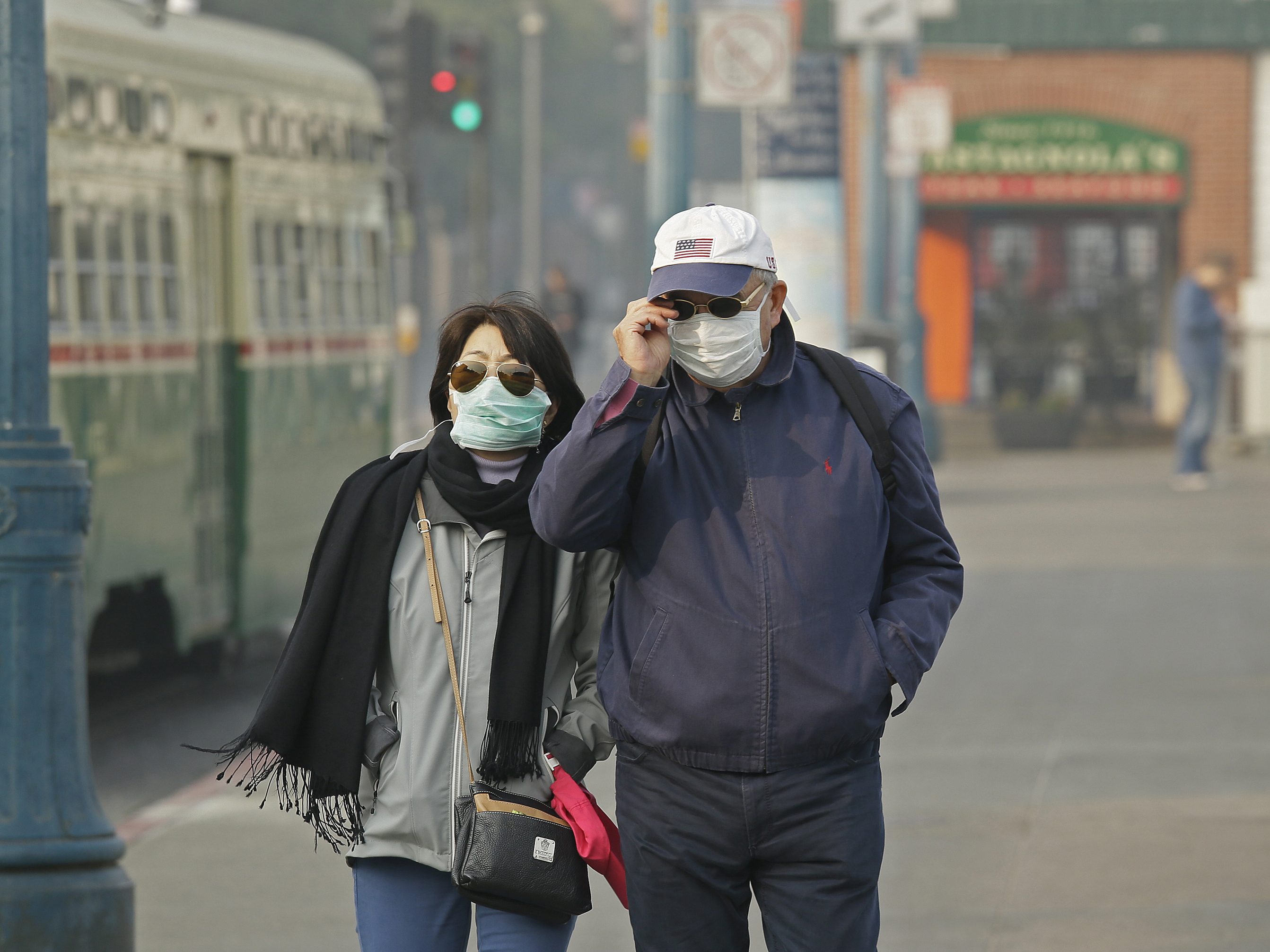 caption: Wildfires caused high levels of air pollution in San Francisco in November 2018. Climate change is making wildfires and heat waves more likely, and driving more days of unhealthy air in many U.S. cities.