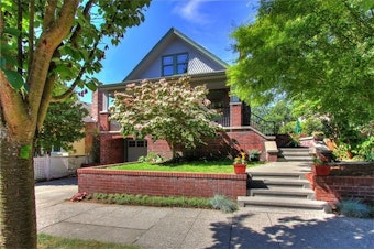 caption: Demand is soaring for Seattle-area homes. Buyers who want to succeed are bidding up prices. This Seattle house recently sold for $100,000 over the asking price. 