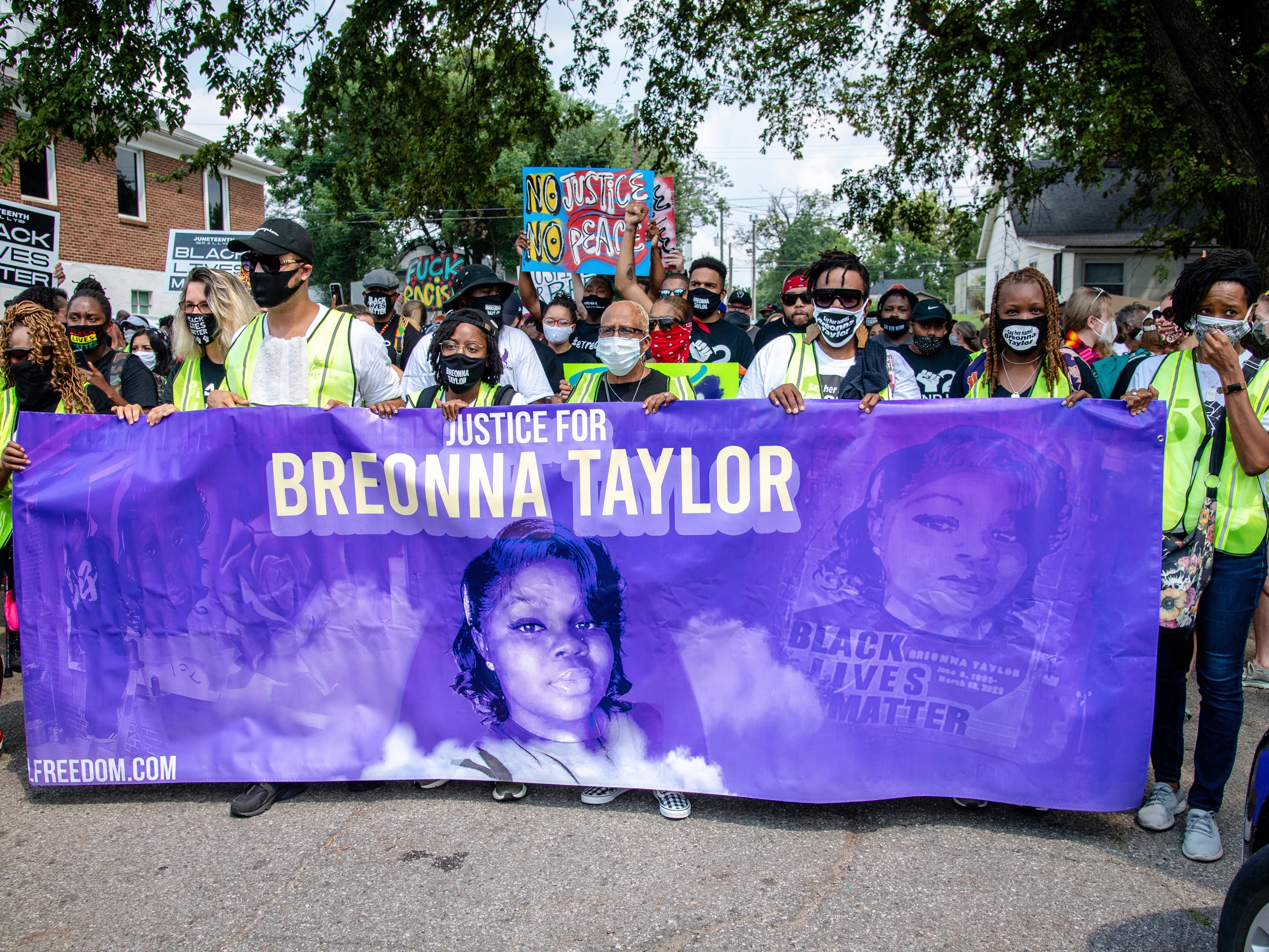 caption: Protesters participate in the Good Trouble Tuesday march for Breonna Taylor, on Tuesday, Aug. 25, 2020, in Louisville, Ky.