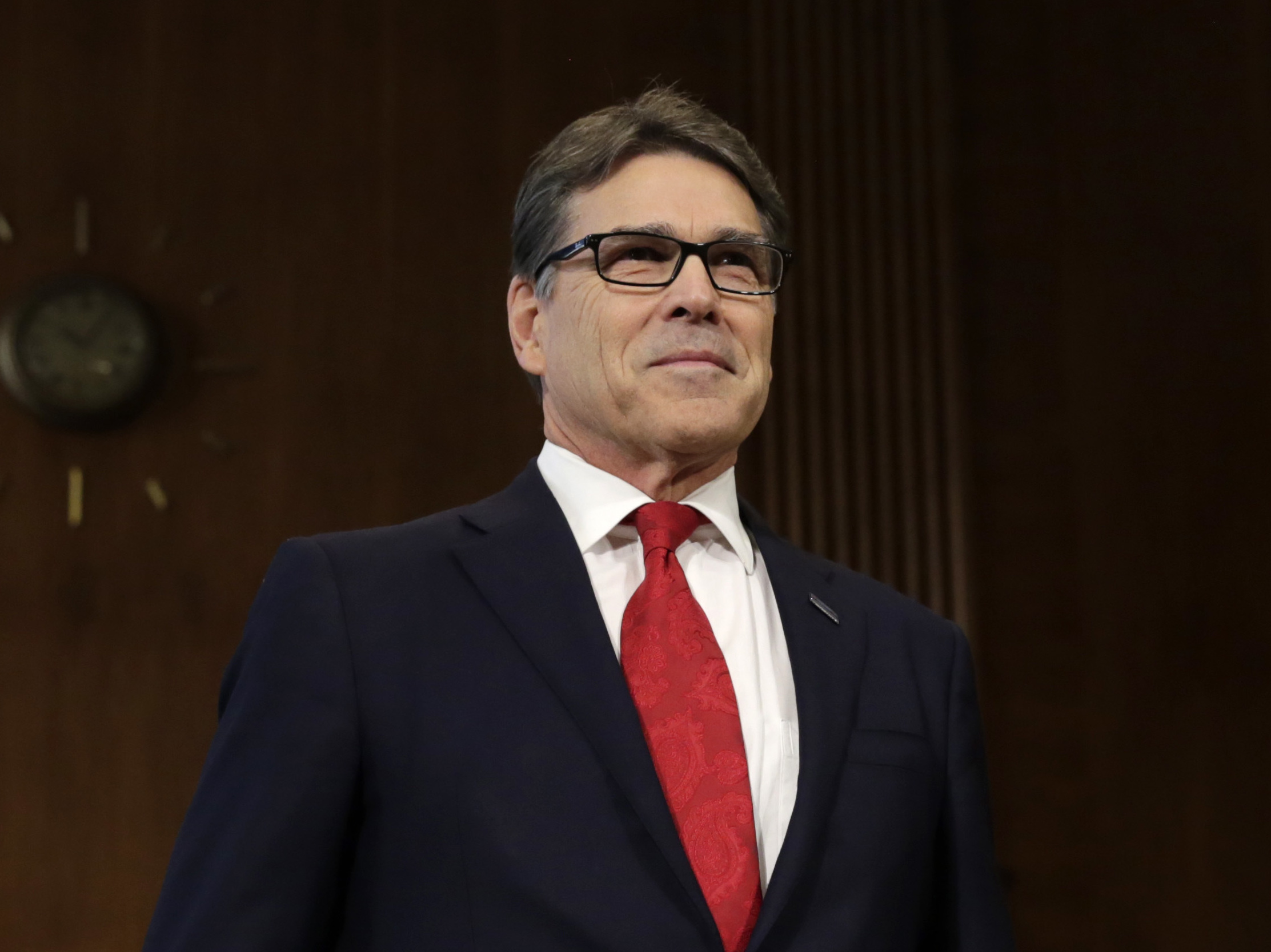 caption: Former Texas Gov. Rick Perry takes a seat before the Senate Energy and Natural Resources Committee hearing on his nomination to be energy secretary on Jan. 19, 2017.