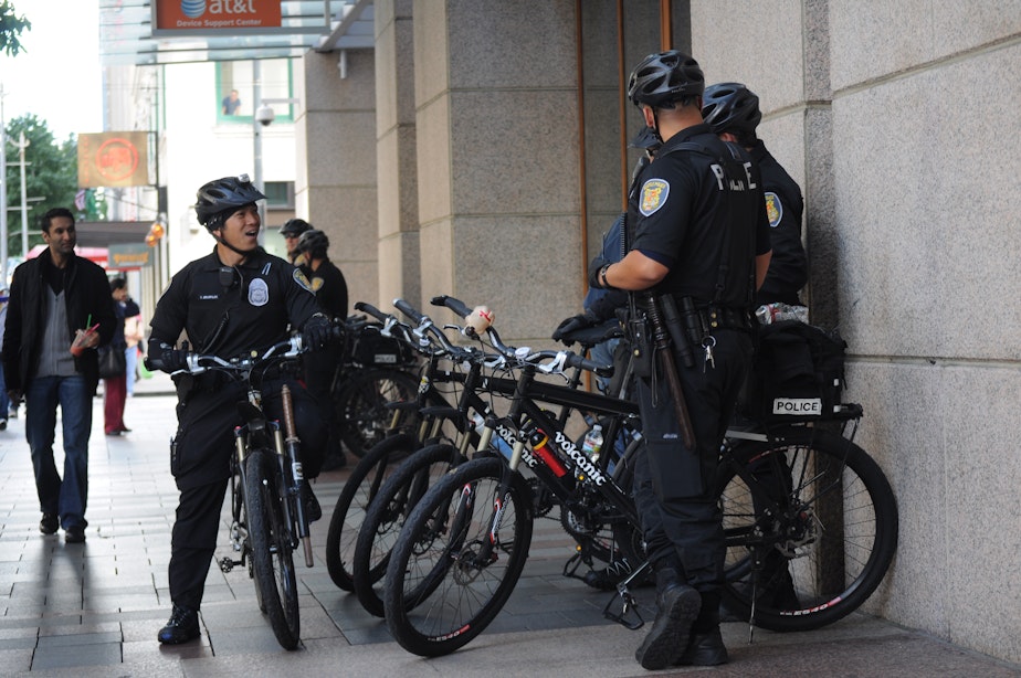 caption: Police officers in downtown Seattle. 