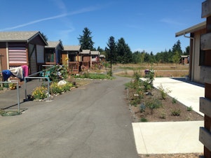 caption: At Quixote Village in Olympia, previously homeless adults live in tiny (144 sq. foot interior) cottages.
