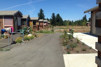 caption: At Quixote Village in Olympia, previously homeless adults live in tiny (144 sq. foot interior) cottages.