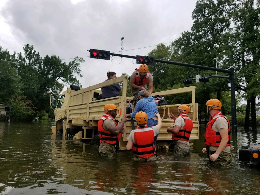caption: Texas National Guard soldiers conduct rescue operations in flooded areas around Houston, Texas 27 August, 2017. (Photo by 1Lt. Zachary West, 100th MPAD)