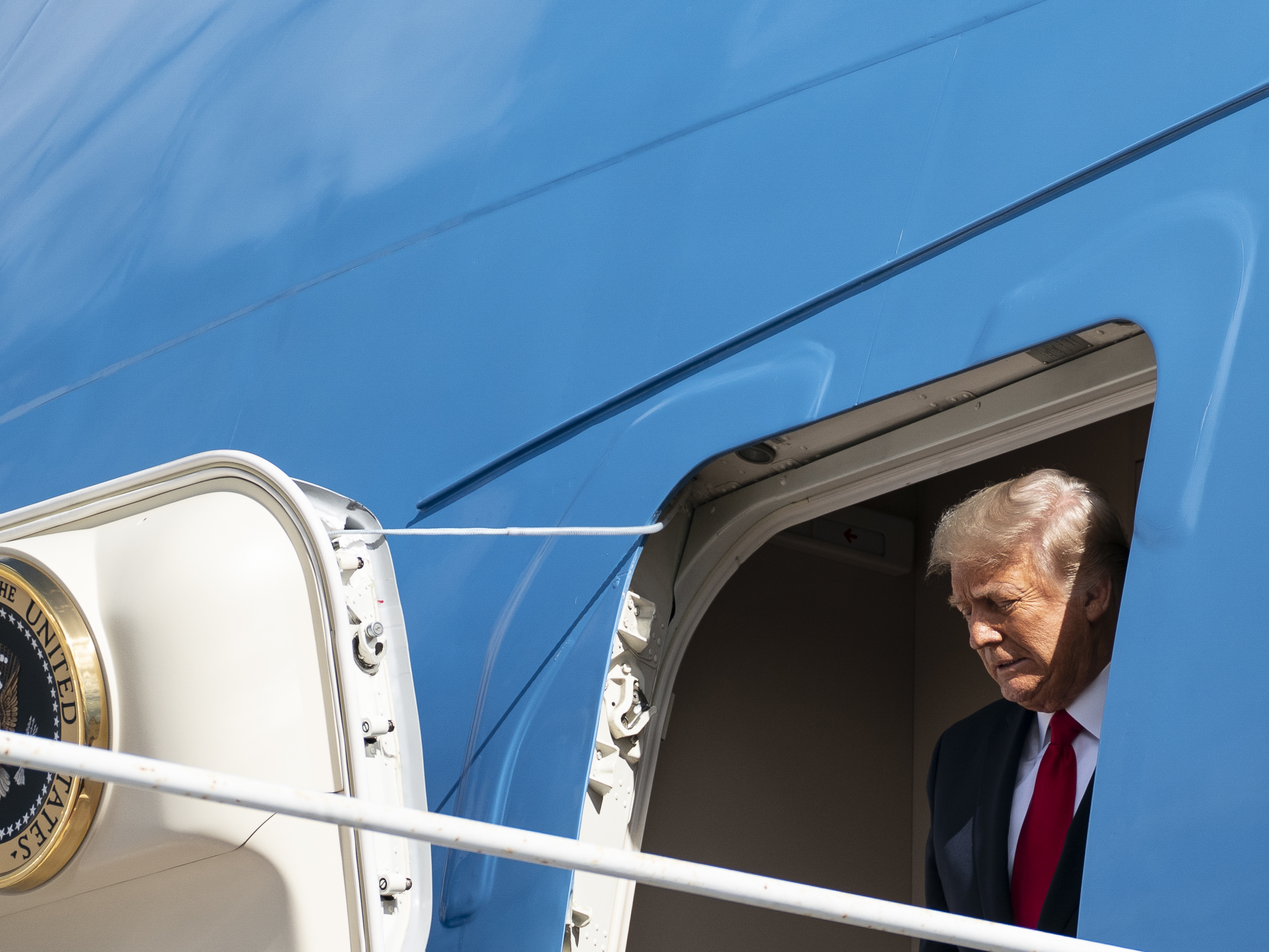 caption: Former President Donald Trump steps off Air Force One on the last day of his presidency on Jan. 20.