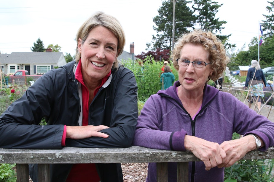 caption: Though on opposite sides of the issue, Pastor Kathy Hawkes and gardener Cindy Krueger have been brought closer together by the challenge to the Ballard P-patch. They both want the garden to remain. The trick is getting there.