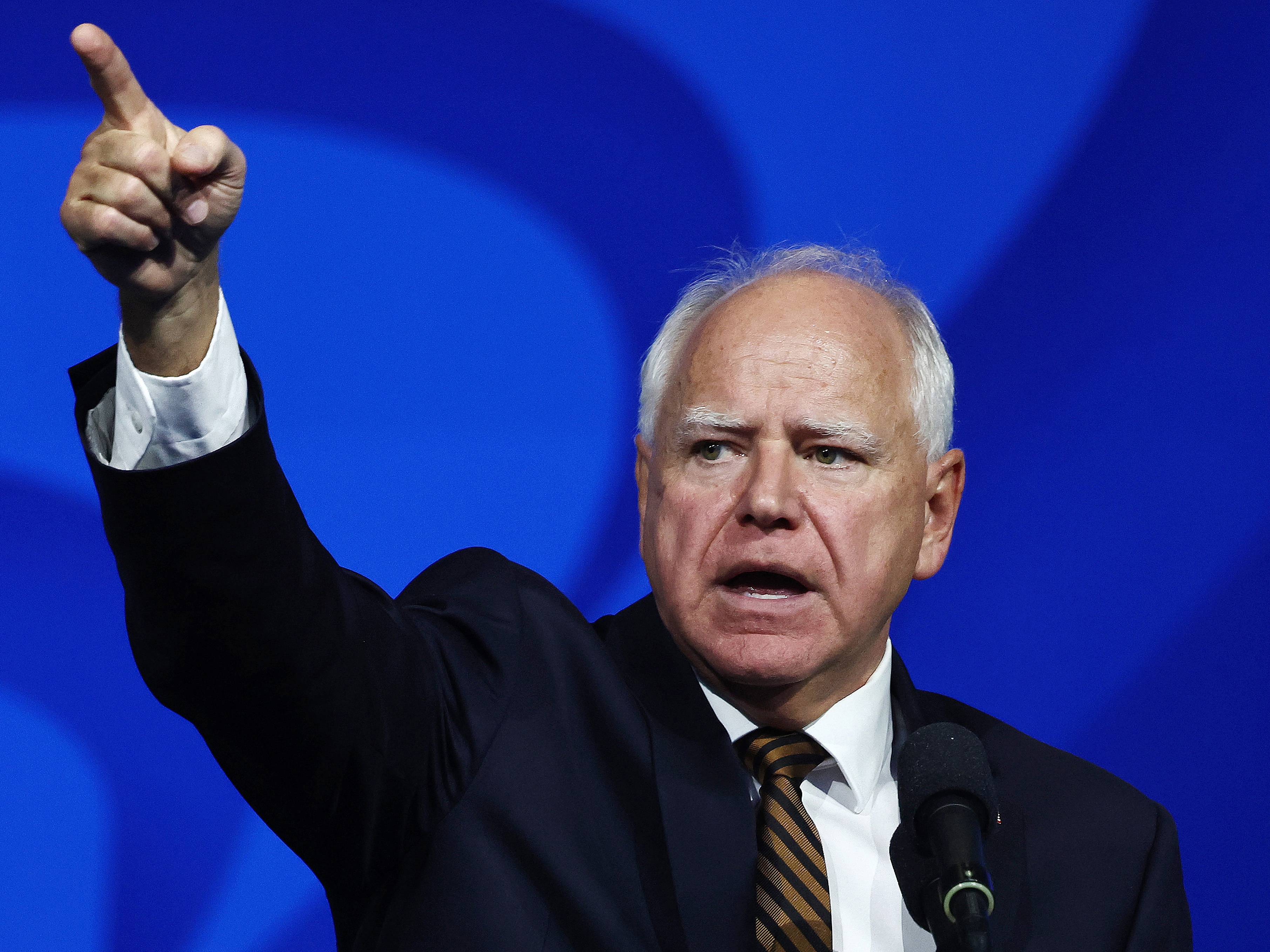 caption: Democratic vice presidential candidate and Minnesota Gov. Tim Walz speaks at the 46th International Convention of the American Federation of State, County and Municipal Employees on Aug. 13 in Los Angeles.
