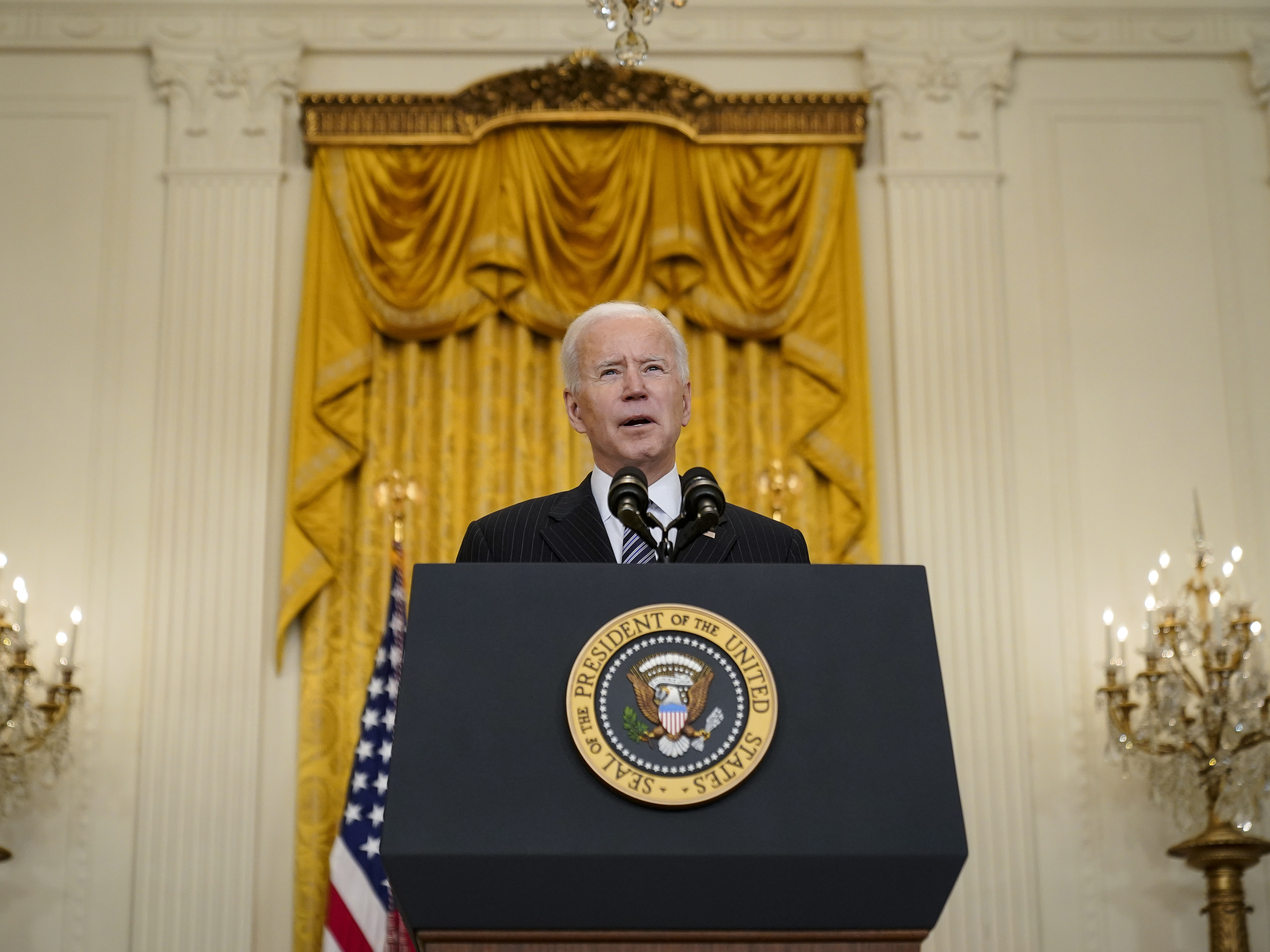 caption: President Biden announces that his administration will meet his goal of administering 100 million COVID-19 vaccine doses 42 days ahead of schedule.