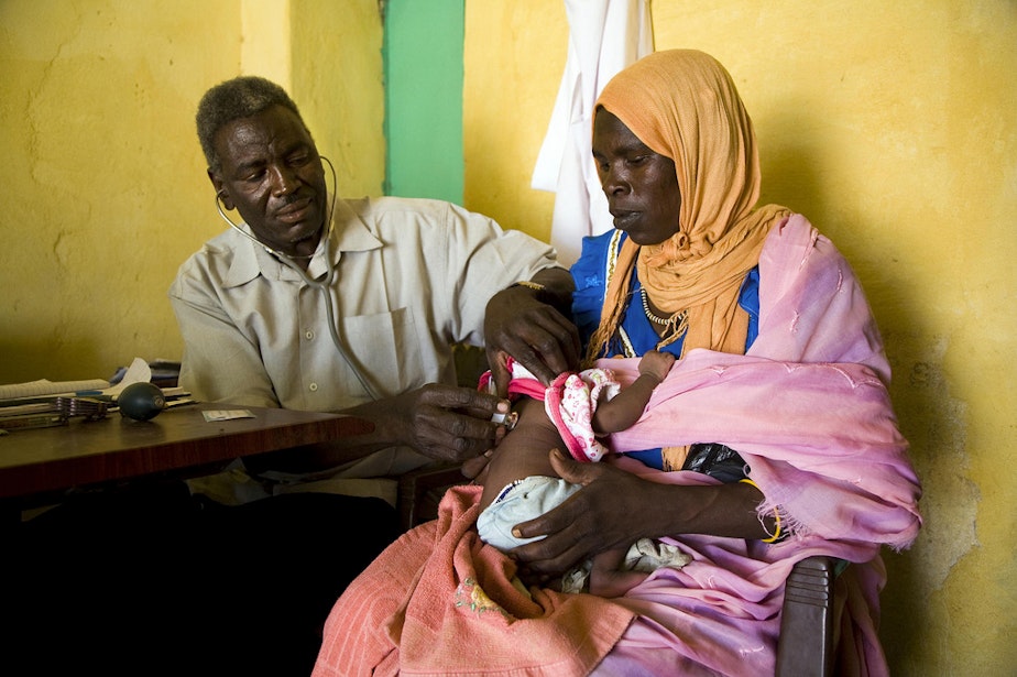 caption: A refugee from the Darfur conflict visits a medical facility in Sudan.