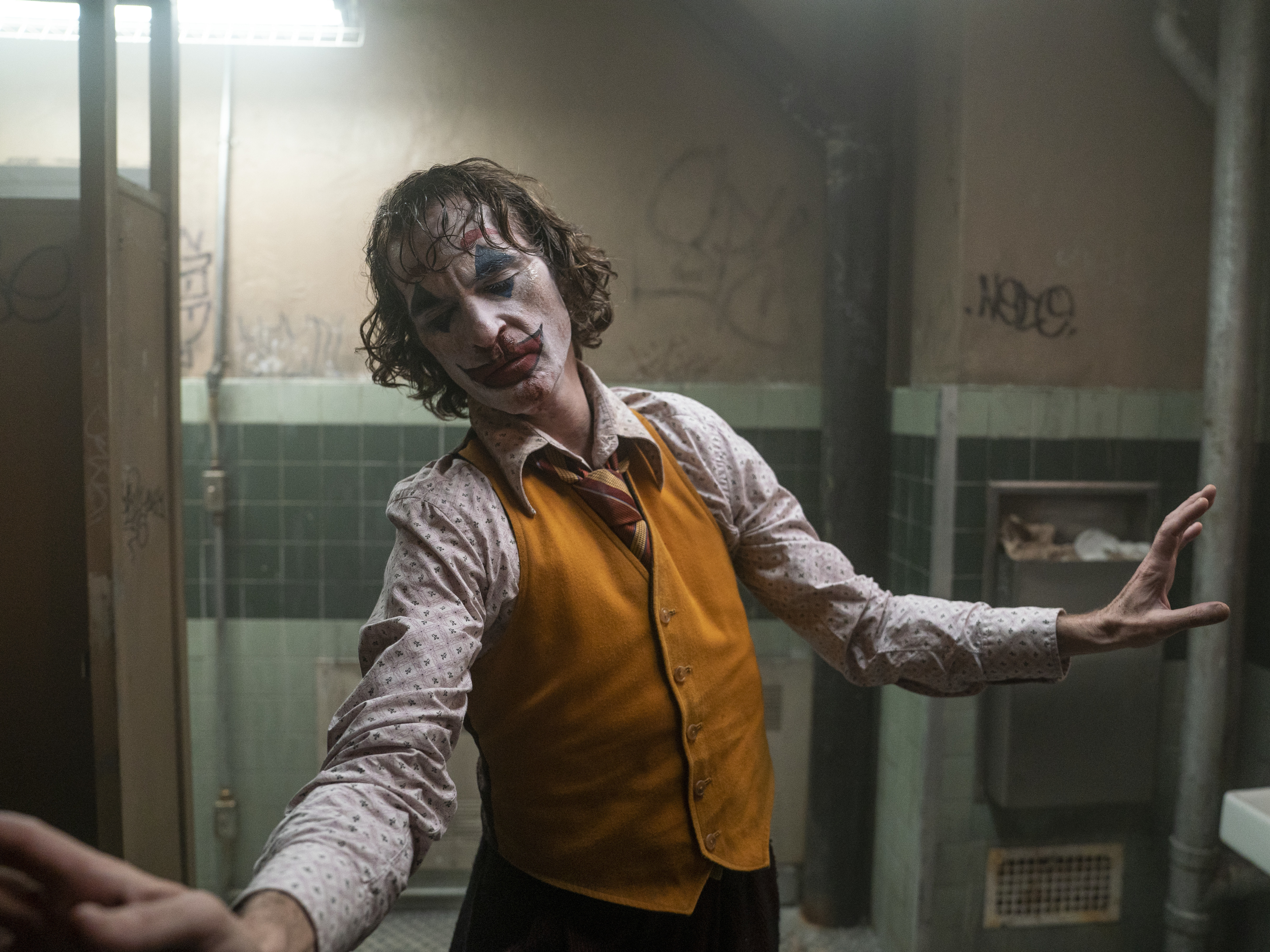 caption: Joaquin Phoenix as Arthur Fleck in Warner Bros. Pictures, Village Roadshow Pictures and BRON Creative's <em>Joker</em>.