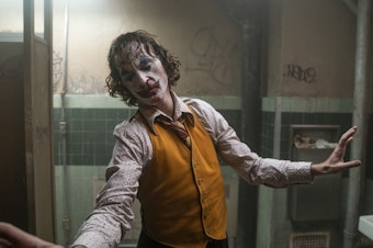 caption: Joaquin Phoenix as Arthur Fleck in Warner Bros. Pictures, Village Roadshow Pictures and BRON Creative's <em>Joker</em>.