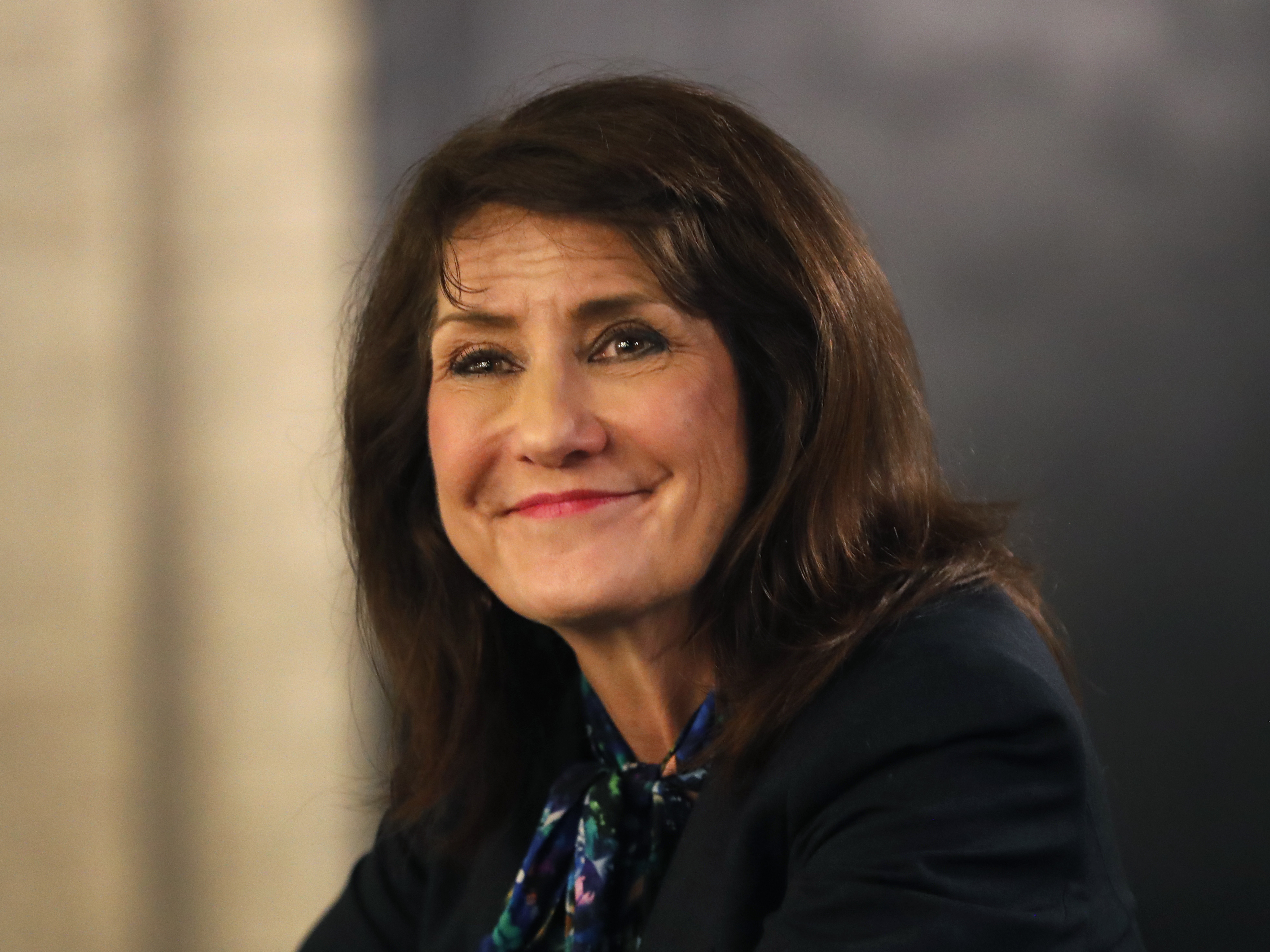 caption: Marie Newman campaigns in the Archer Heights neighborhood of Chicago.