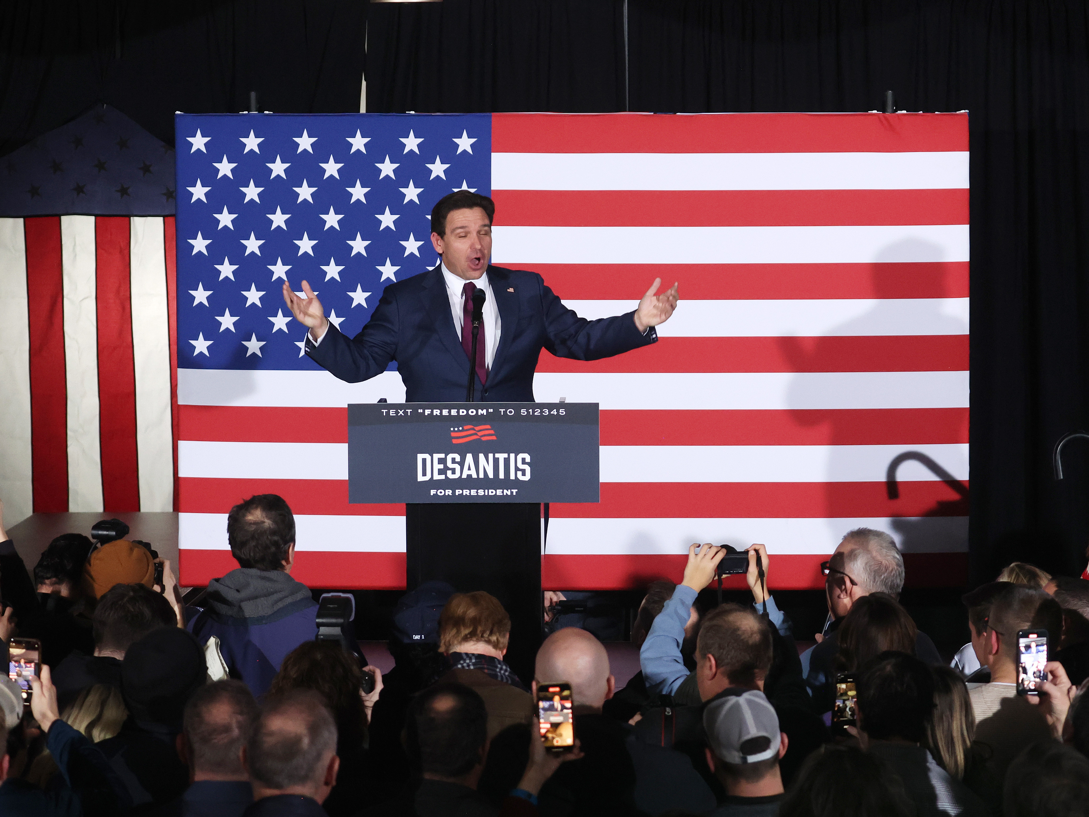 caption: Republican presidential candidate Florida Gov. Ron DeSantis speaks at his caucus night event on January 15, 2024 in West Des Moines, Iowa.