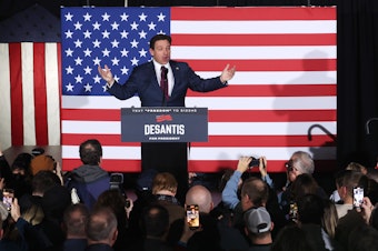 caption: Republican presidential candidate Florida Gov. Ron DeSantis speaks at his caucus night event on January 15, 2024 in West Des Moines, Iowa.
