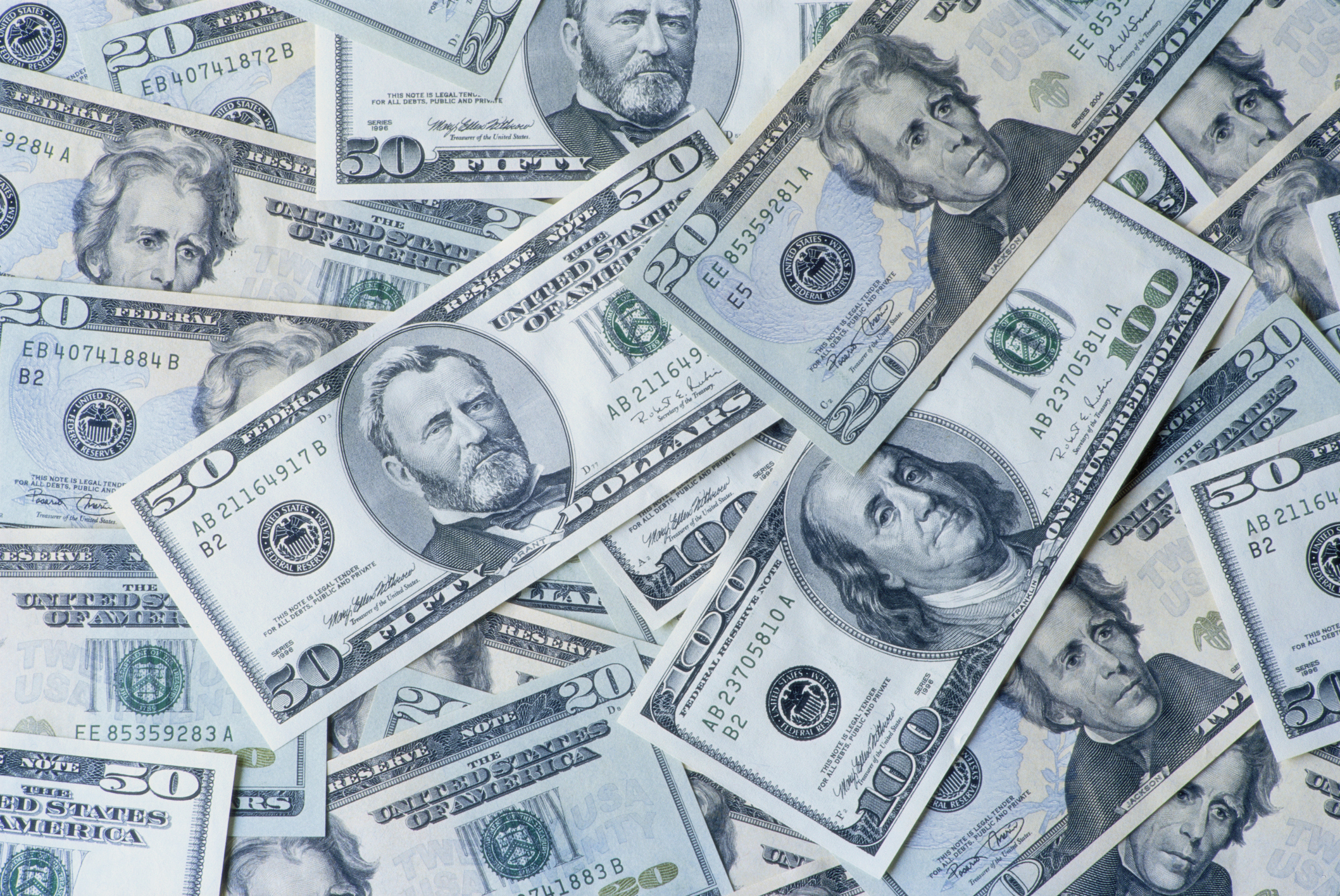 caption: Invest in racial justice by putting your dollars into funds, banks, projects and businesses that promote and advance people of color. (Getty Images)