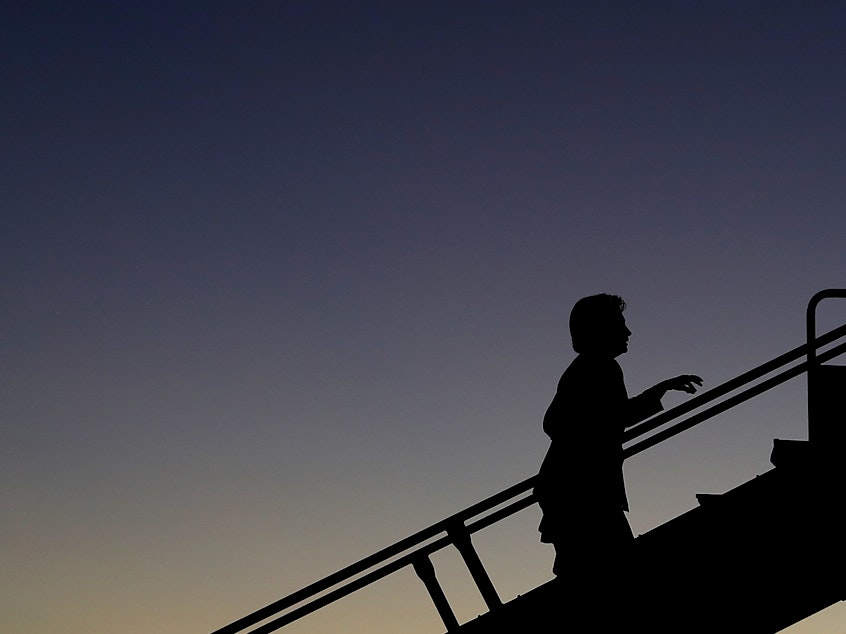 caption: Democratic presidential nominee Hillary Clinton boards her campaign plane at Cleveland Burke Lakefront Airport on November 6, 2016 in Cleveland, Ohio.