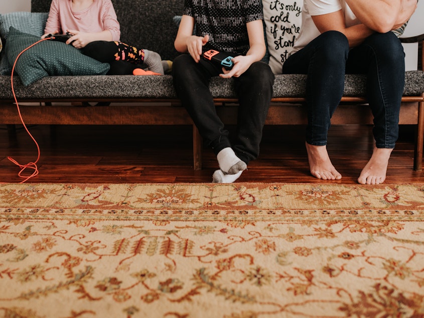caption: As people make efforts to stay apart from each other physically, video games are filling the socializing gap.