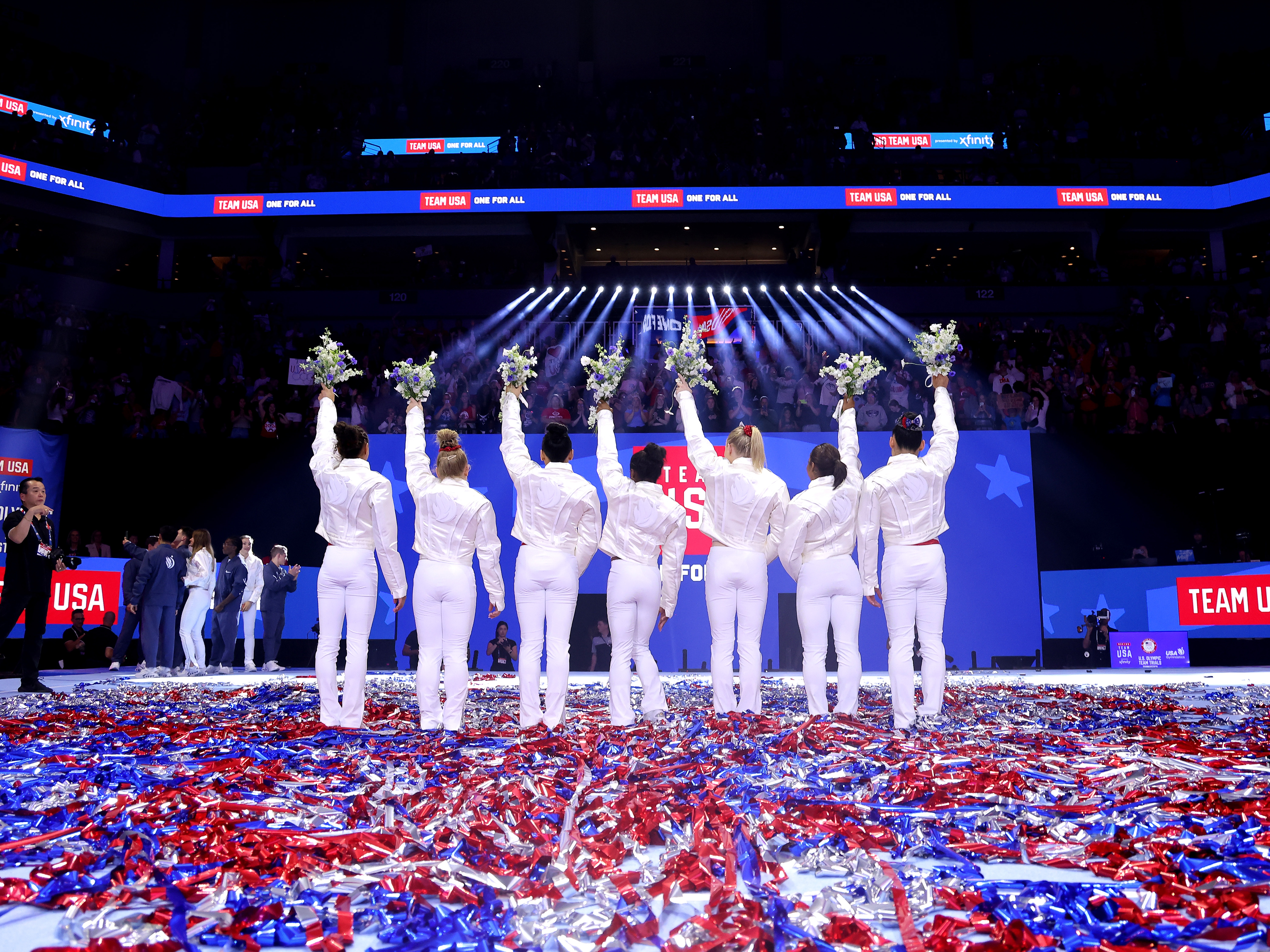caption: From left, Hezly Rivera, Joscelyn Roberson, Suni Lee, Simone Biles, Jade Carey, Jordan Chiles and Leanne Wong pose after being selected for the 2024 U.S. Olympic Women's Gymnastics Team on Day Four of the 2024 U.S. Olympic Team Gymnastics Trials in Minneapolis.