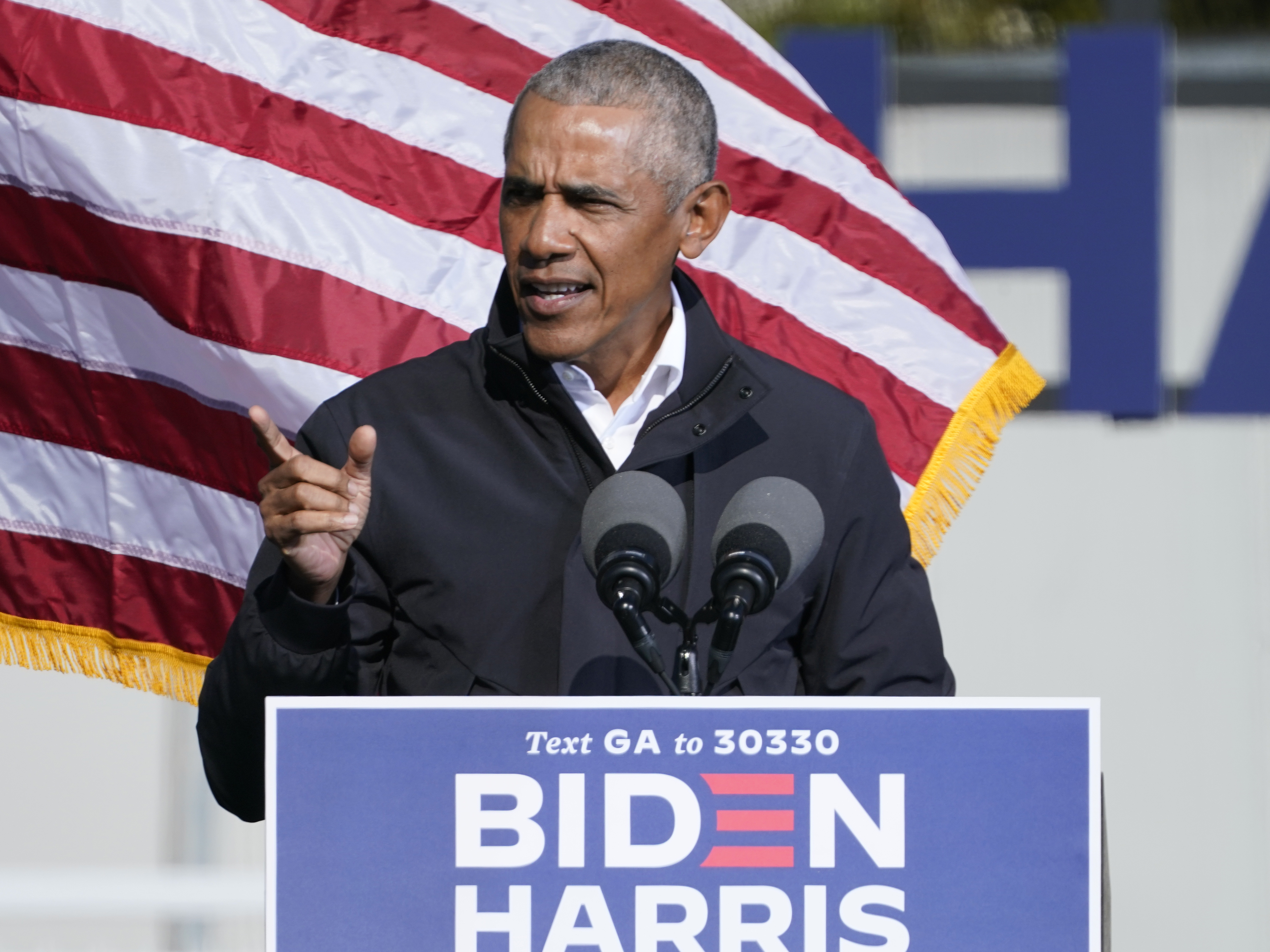 caption: Former President Barack Obama speaks at a rally as he campaigns for Democratic presidential candidate former Vice President Joe Biden, Monday, Nov. 2, 2020, at Turner Field in Atlanta. (AP Photo/Brynn Anderson)
