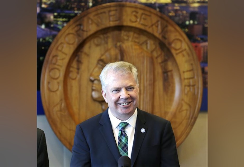 caption: Seattle Mayor Ed Murray smiles as he addresses a news conference on a proposal to increase the minimum wage in the city Thursday, April 24, 2014, in Seattle.