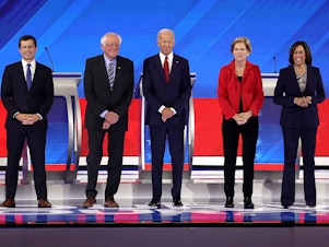 caption: Ten democratic presidential candidates appear onstage before the start of the Democratic Presidential Debate at Texas Southern University in Houston on Thursday.