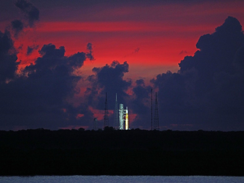 caption: The Artemis 1 moon rocket at Launch Pad 39 at the Kennedy Space Center.