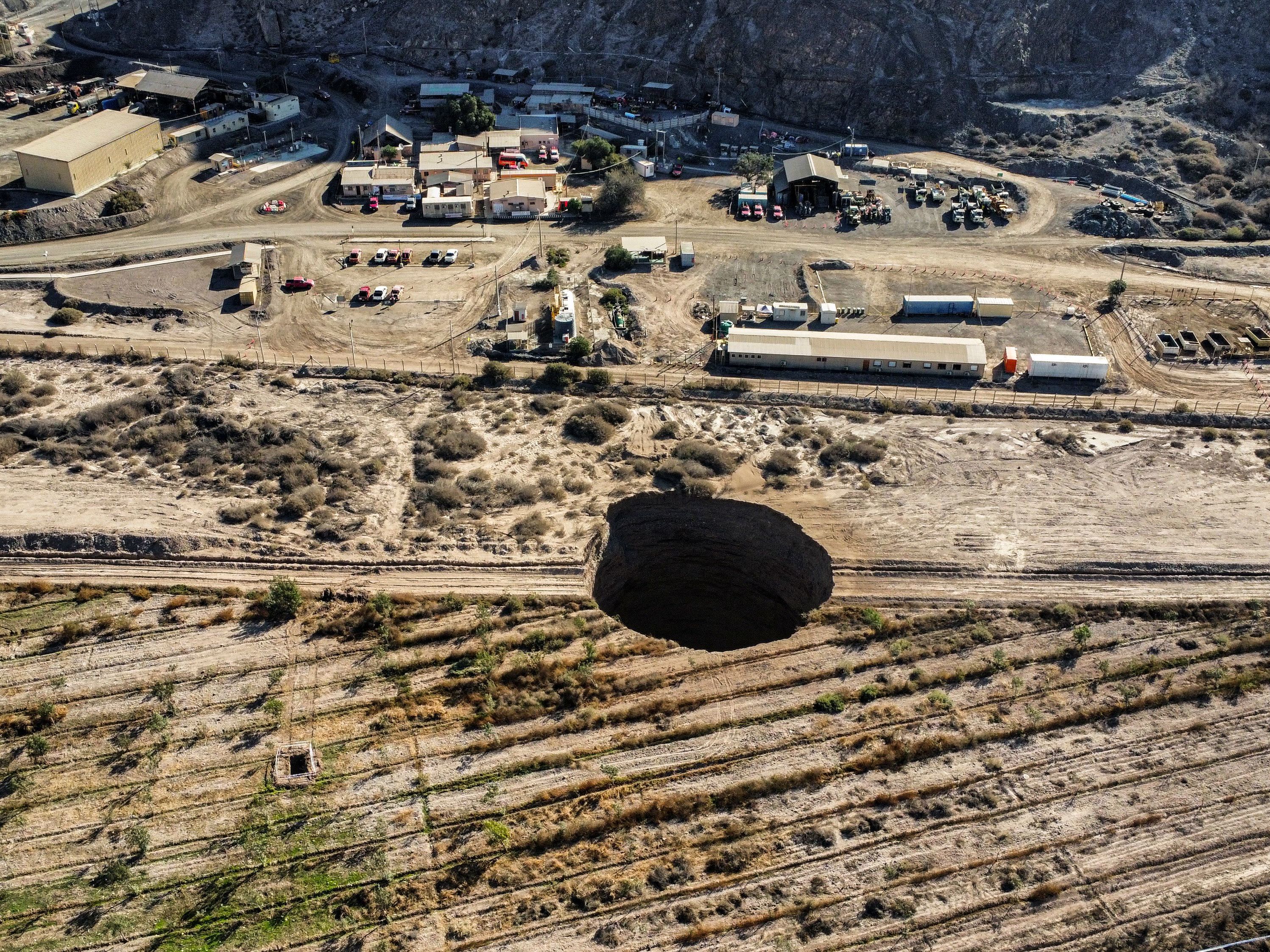 caption: What caused the sinkhole has not yet been determined, but experts are investigating.