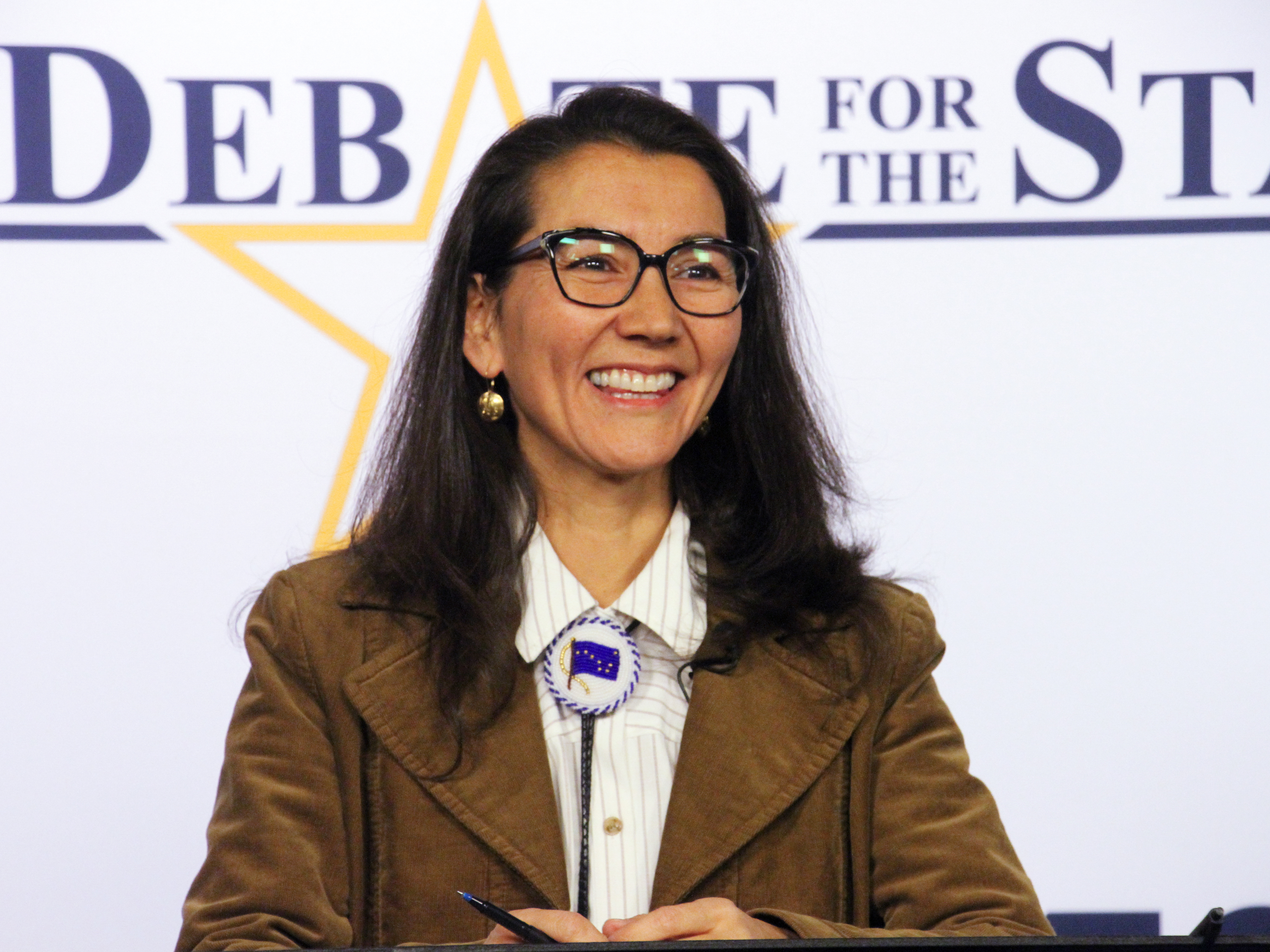 caption: U.S. Rep. Mary Peltola smiles before a debate for Alaska's sole U.S. House seat on Oct. 26, in Anchorage, Alaska. Peltola was elected to a full term in the House on Wednesday, Nov. 23, months after the Alaska Democrat won a special election to the seat following the death earlier this year of longtime Republican Rep. Don Young.