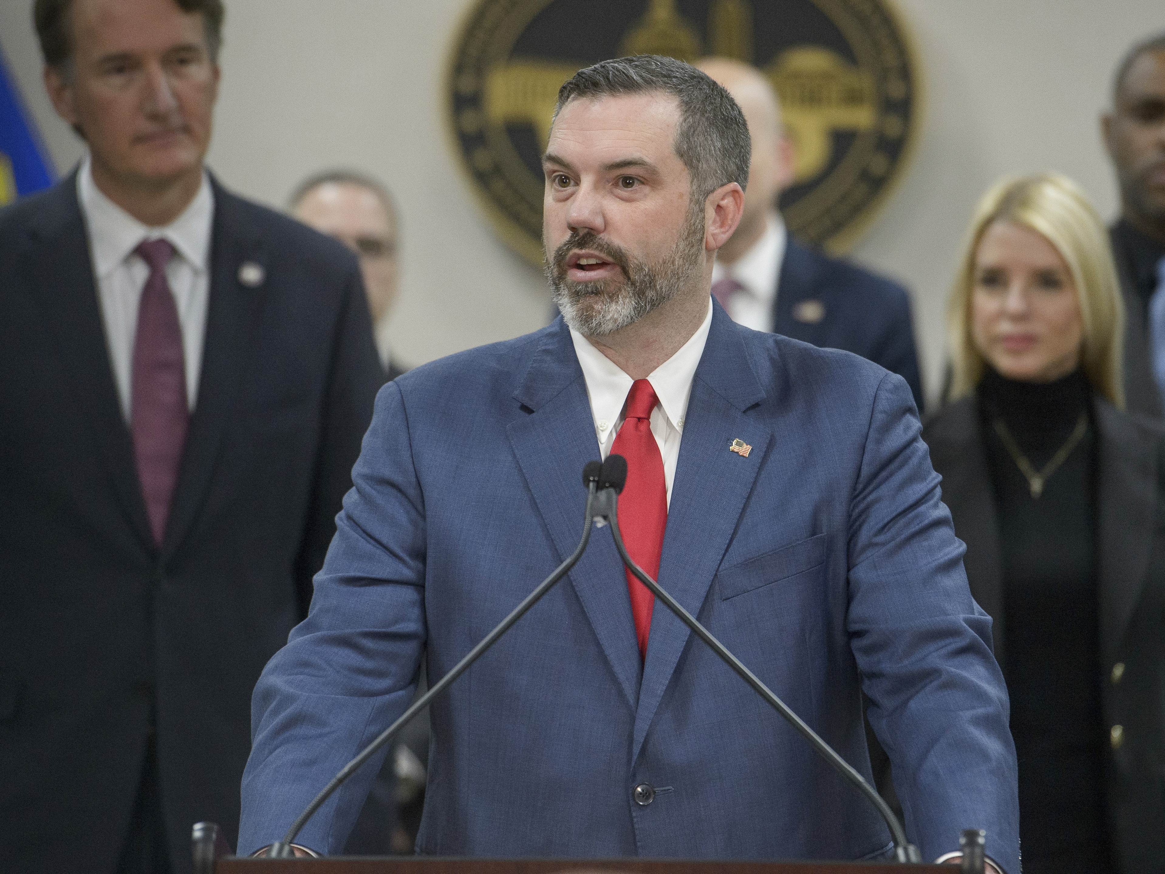 caption: Erik Siebert, then interim U.S. Attorney for the eastern district of Virginia, speaks at a news conference on March 27 at an FBI field office in Manassas, Va. Siebert resigned Friday after President Trump said he wanted him "out" after the U.S. attorney's mortgage fraud investigation into New York Attorney General Letitia James failed to result in criminal charges.