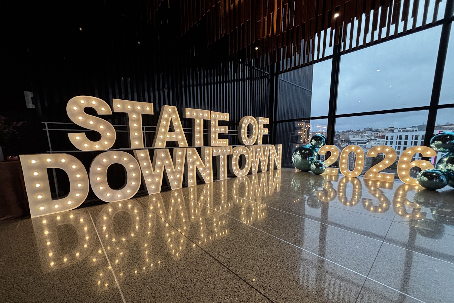 caption: A sign at the Downtown Seattle Association's State of Downtown event.
