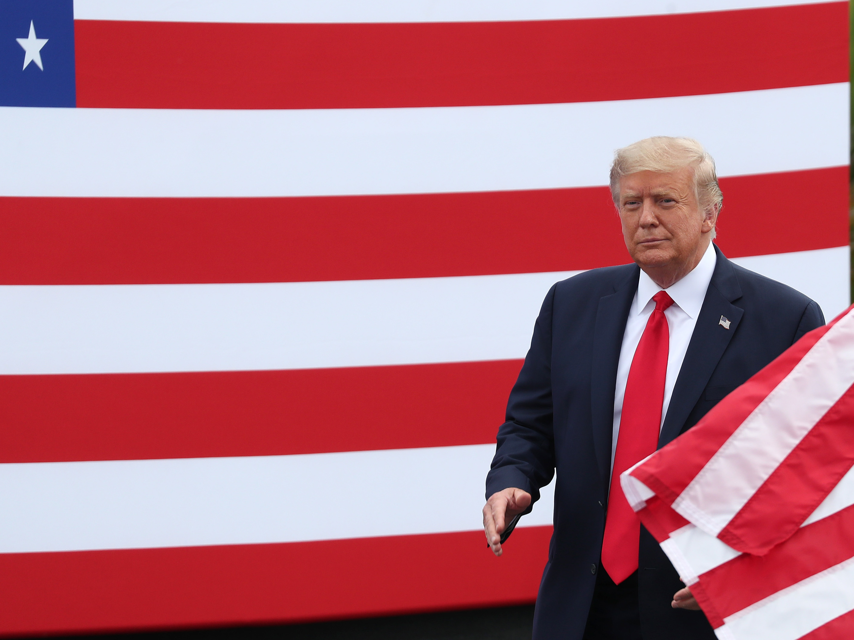 caption: President Trump arrives to speak about the environment during a Tuesday stop in Jupiter, Florida.