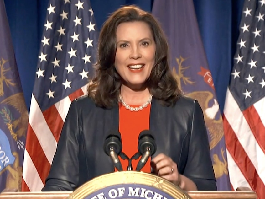 caption: Michigan Gov. Gretchen Whitmer in an online political event in August. Authorities say they short-circuited a plot to kidnap her. An eighth man has now been charged in the case.