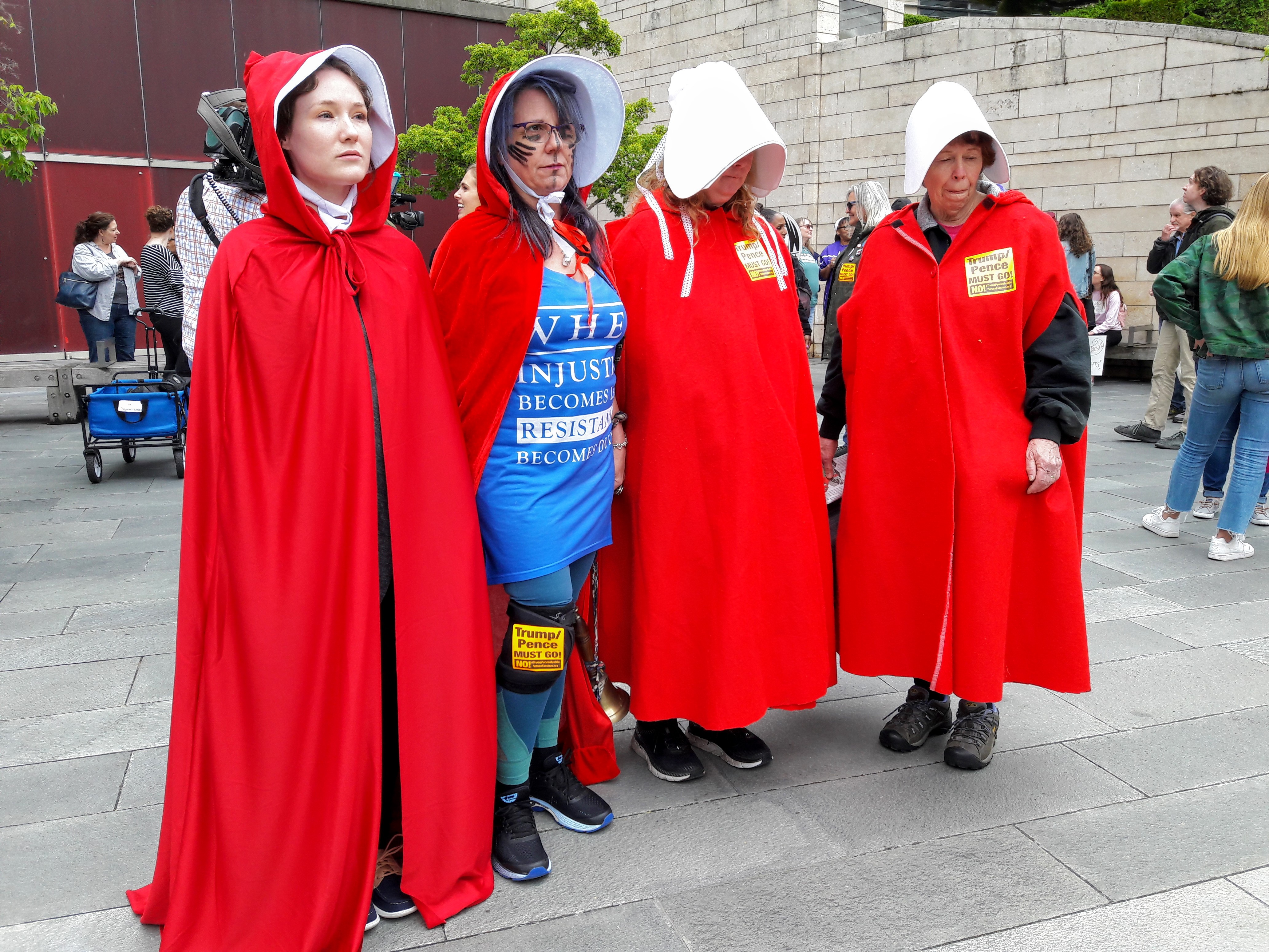 caption: From left to right: Rachael Scott, Lisa Brown, Kathy Wallace, and Holly Brewer in costumes from The Handmaid's Tale.