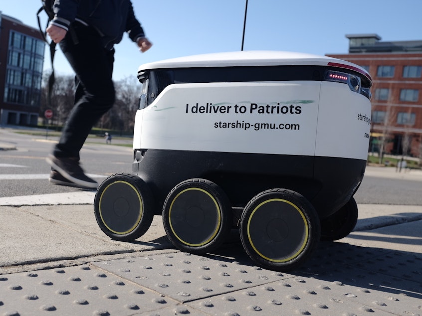 caption: At George Mason University in Virginia, a fleet of several dozen autonomous robots deliver food to students on campus.