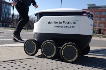 caption: At George Mason University in Virginia, a fleet of several dozen autonomous robots deliver food to students on campus.