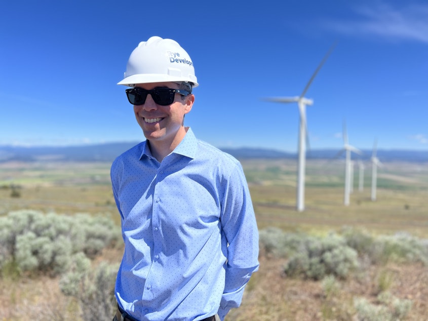 caption: Erik Steimle, vice president of Rye Development, stands near where his company would like to build an upper reservoir for a pumped storage project near Goldendale, Washington.