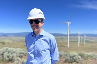 caption:  Erik Steimle, vice president of Rye Development, stands near where his company would like to build an upper reservoir for a pumped storage project near Goldendale, Washington.