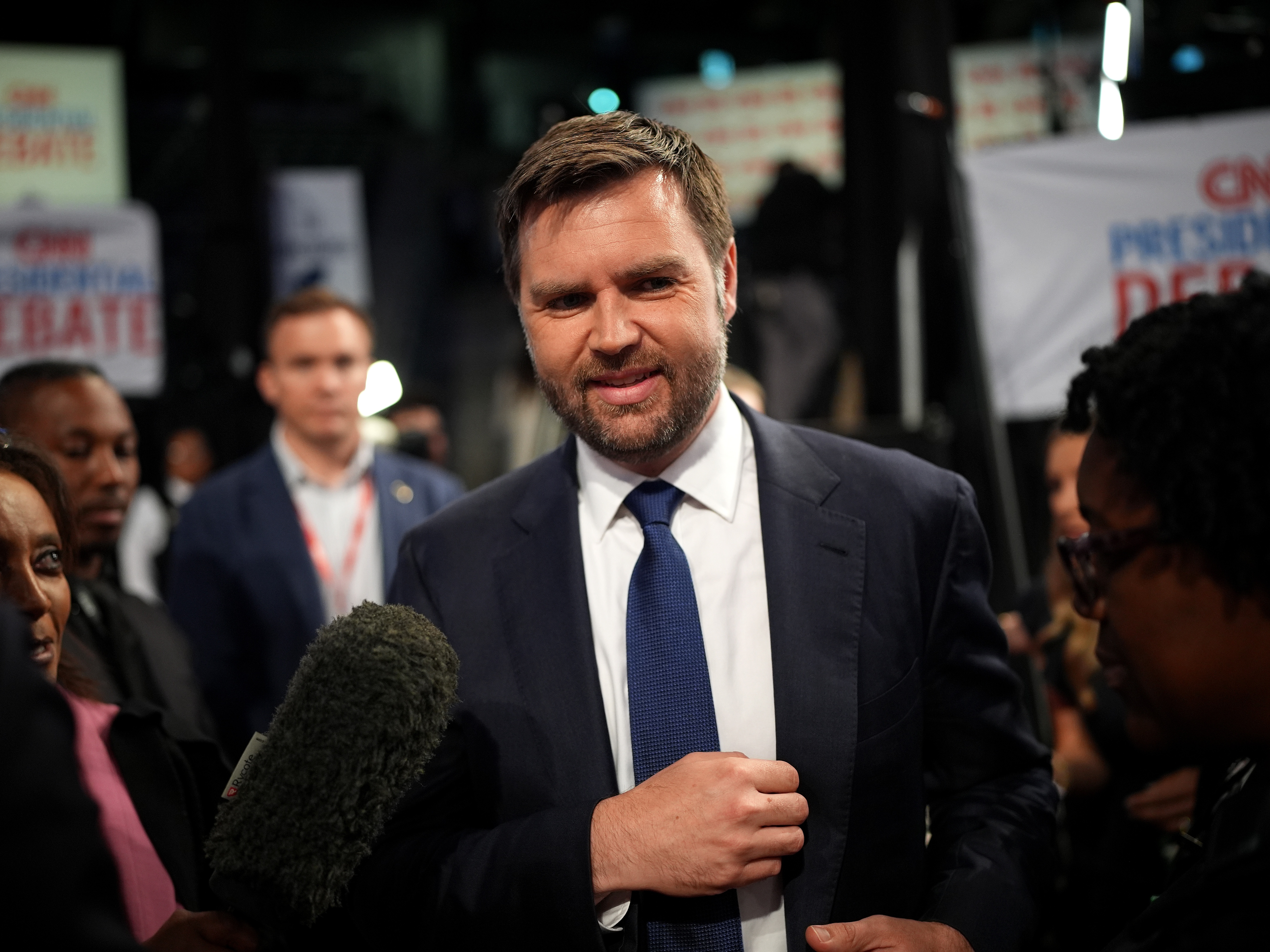caption: U.S. Sen. JD Vance (R-Ohio) speaks to reporters in the spin room after the CNN Presidential Debate in June 2024 in Atlanta, Ga.