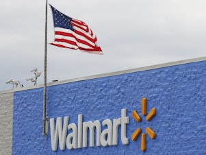 caption: On Tuesday, the Justice Department filed a civil suit accusing Walmart of failing to stop "hundreds of thousands" of improper opioid transactions at its chain of pharmacies.