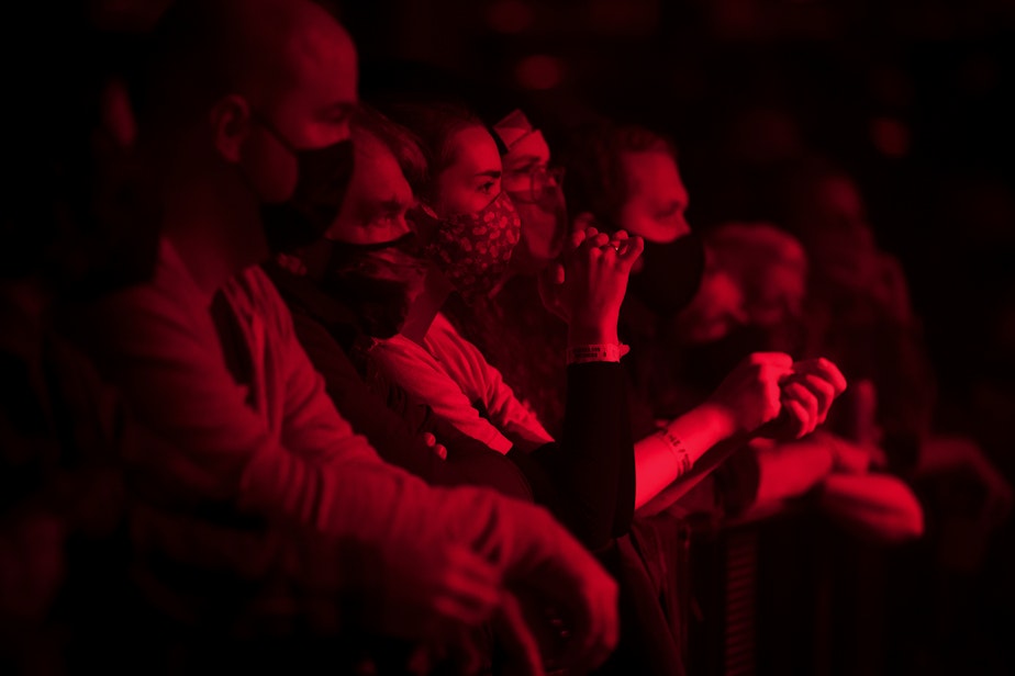 caption: Fans listen as Mini Trees performs on Friday, November 12, 2021, at Showbox in Seattle. 