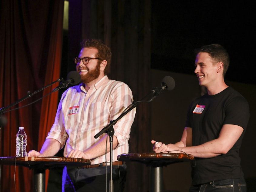 caption: Contestants Nolan Boggess and Alex Smailes appear on <em>Ask Me Another</em> at the Bell House in Brooklyn, New York.