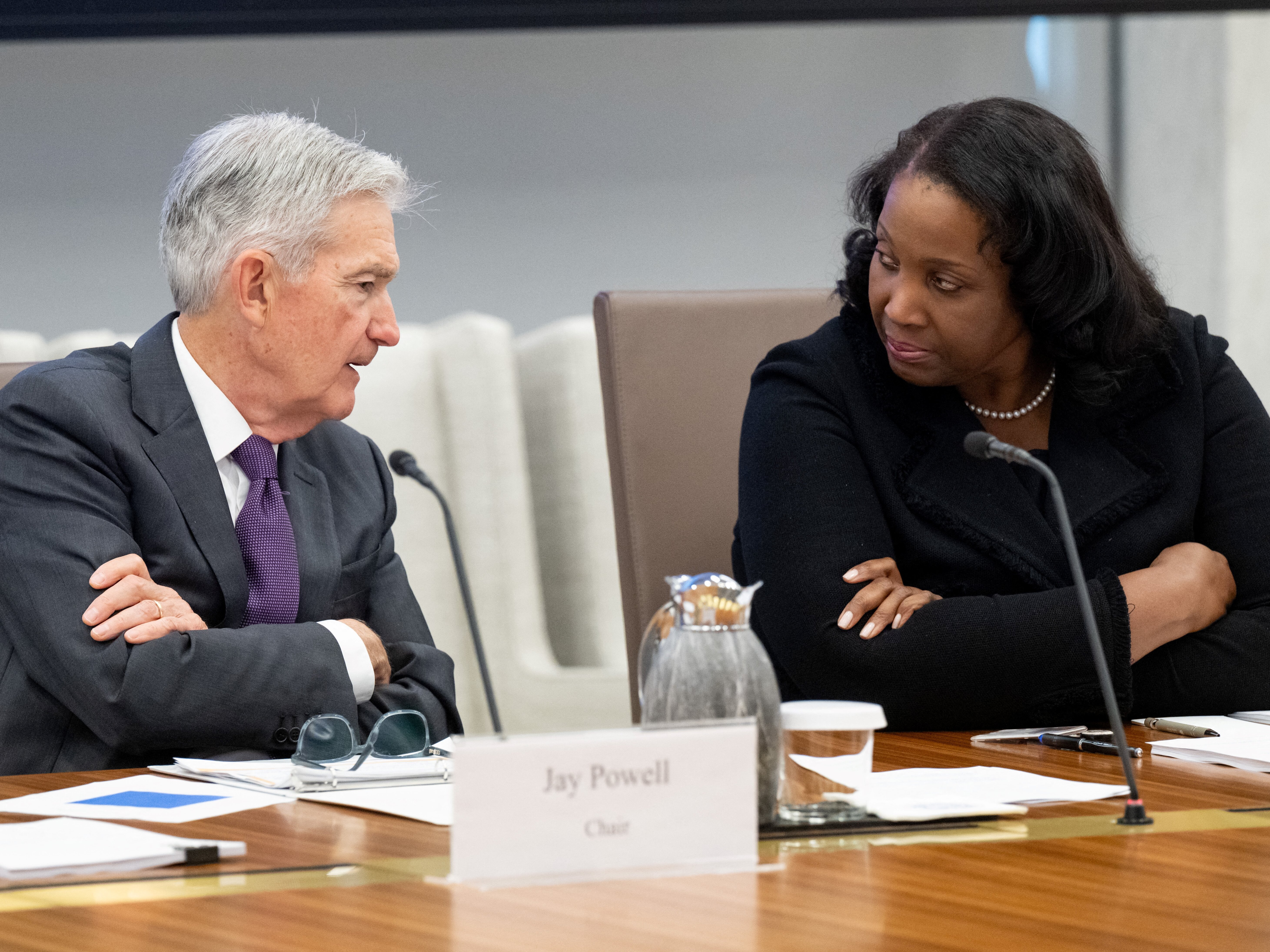 caption: Fed Chair Jerome Powell speaks with Lisa Cook, a member of the Board of Governors of the Federal Reserve, during a meeting in Washington on June 25. President Trump's desire to fire Cook for cause is at the center of Wednesday's Supreme Court argument — an argument that could have major consequences for financial markets and the broader economy.