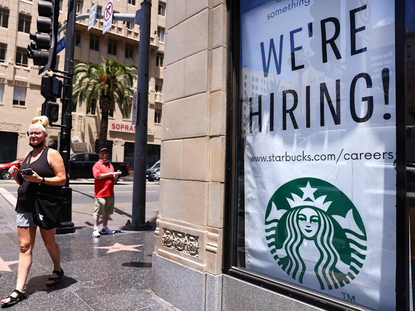 caption: A recruitment sign hangs at Starbucks in Los Angeles.